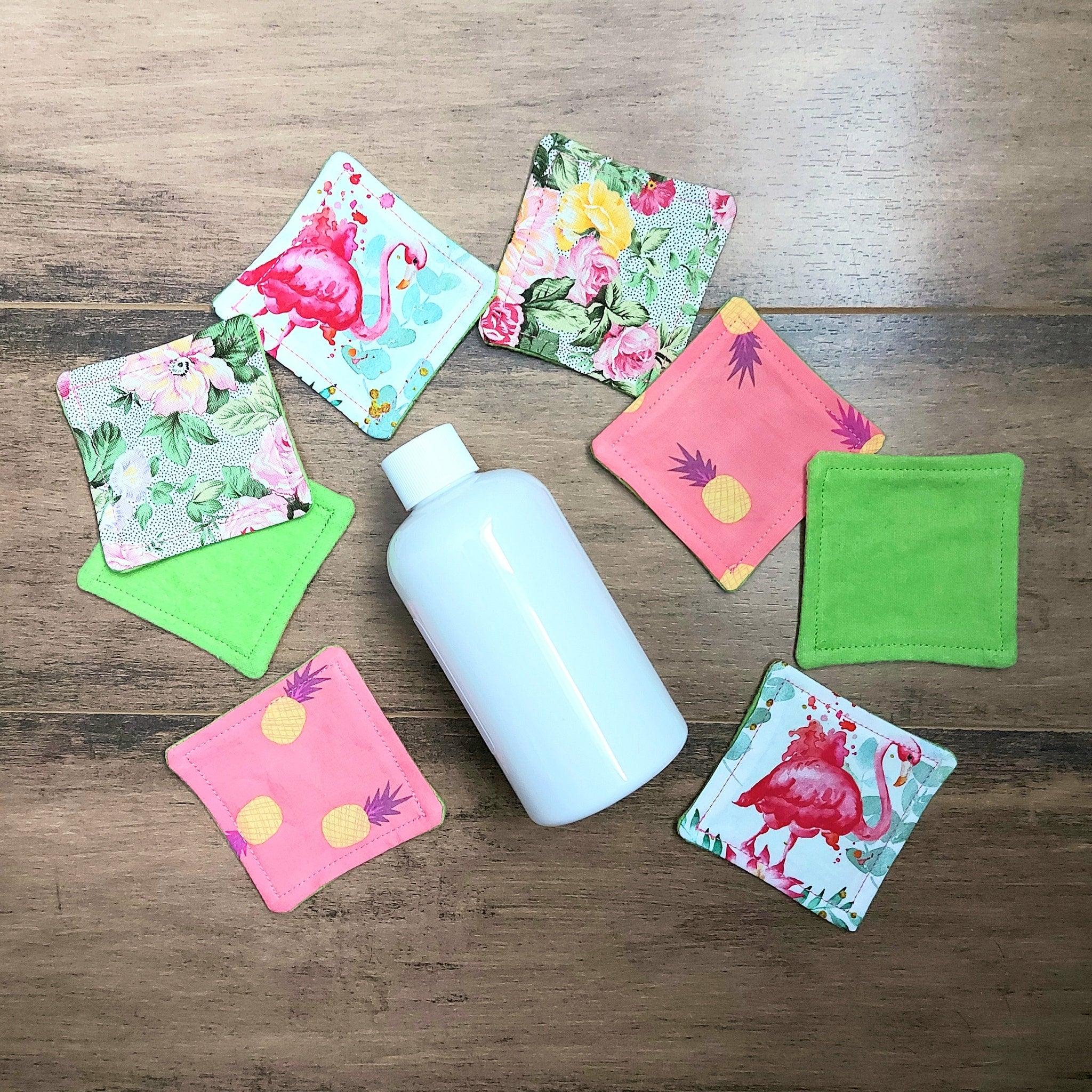 Makeup remover pads with floral, pineapple & flamingo patterns, fabric, and green backing pads