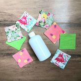Makeup remover pads with floral, pineapple & flamingo patterns, fabric, and green backing pads