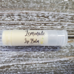 Lemonade Lip Balm in clear tube with yellow balm and Griffin Lily Designs label