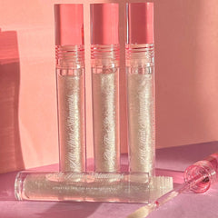 Lip gloss tubes with pink caps, clear tubes, and glittery contents, by PinkishPurrple