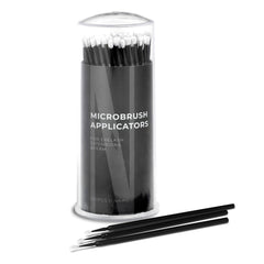 Microbrush applicators, black plastic sticks with white tips, in a clear container, Nanolash text visible