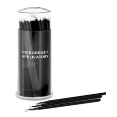 Microbrush applicators in black with white tips, in a clear plastic container, Nanolash visible