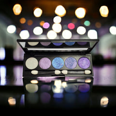 Side view of refillable eyeshadow palette with five duo-chrome shades in a sleek black compact
