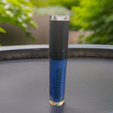 Lip gloss tube with blue liquid, black cap, and Lilybee Lips text visible