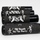 Lip balm, black tubes with white skeleton design and text, for Halloween party favors