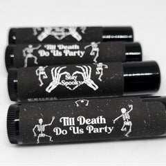 Lip balm, black tubes with white skeleton design and text, for Halloween party favors