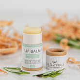 Lip balm with light yellow balm, white and brown paper tube, and J&L Naturals label