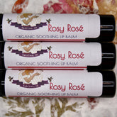 Lip balm tubes with white labels, red text "Rosy Rosé", and black tubes, GypsyBeeFarm brand
