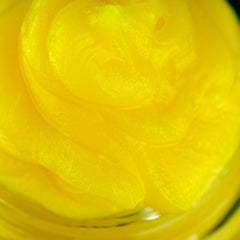 Yellow swirl with smooth texture and glossy finish, close-up view