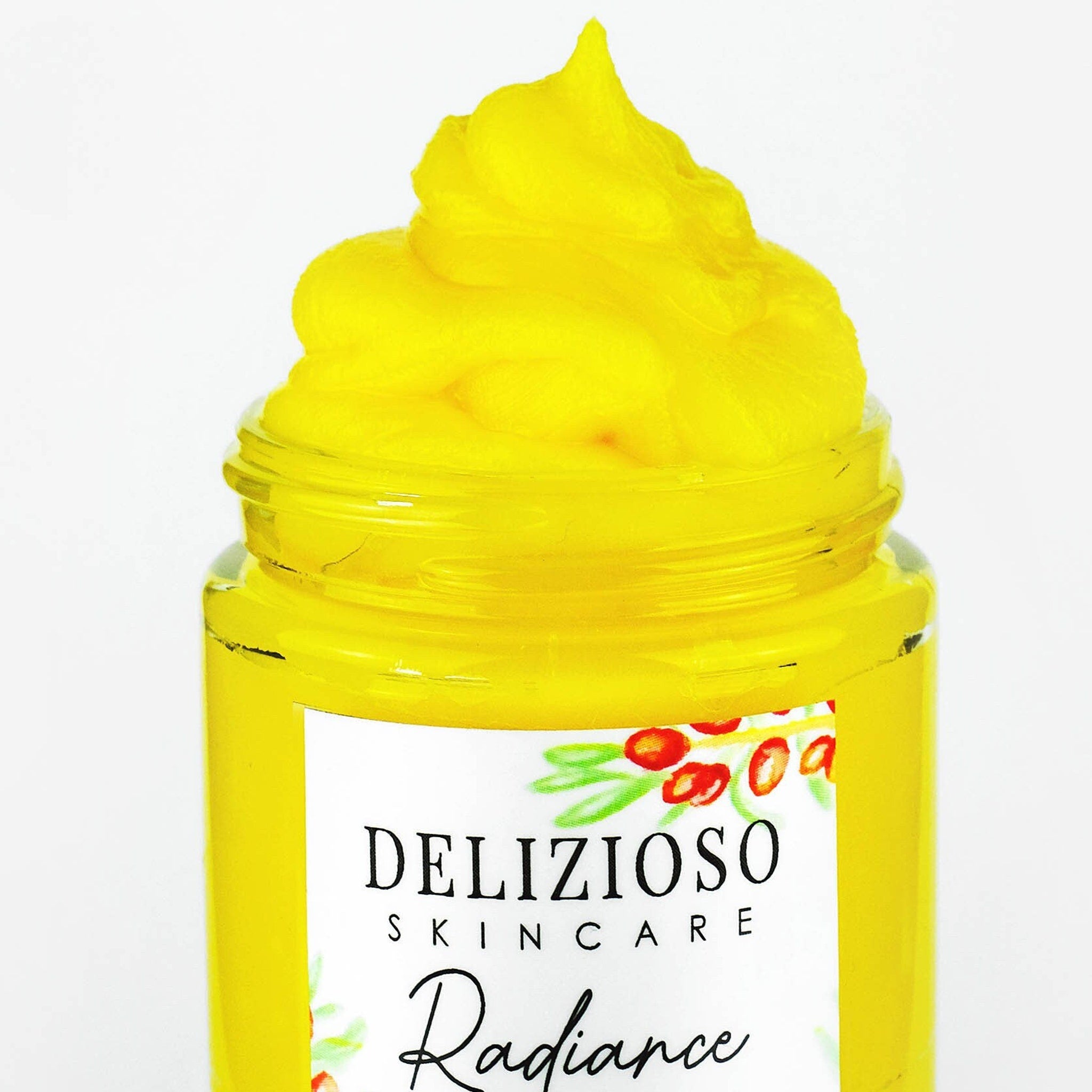 Facial cleanser balm in yellow, glass jar, with visible "Delizioso Skincare" label