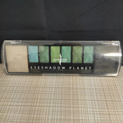 Side view of black eyeliner pencil with sharpened tip and glossy finish, showcasing precise application angle