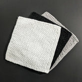 Set of two soft black and white cotton face cloths for gentle skincare routines