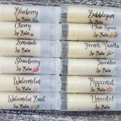 Lip balm tubes in white, clear, and cream colors with Griffin Lily Designs text on labels