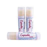Lip balm tubes with white, pink, and blue polka dot pattern and Blue Poppy brand name visible