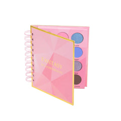 Eyeshadow palette with pink and gold accents, spiral binding, and "Fantasy" text by Lavish Beauty