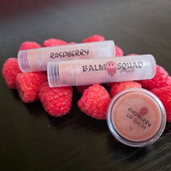 Raspberry lip balm, clear tube and container, pink balm, with raspberry fruit