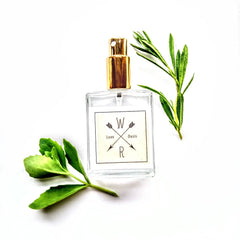 Face toner bottle with gold cap, clear glass, and "Oasis" label with green leaves