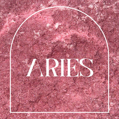 Aries text on pink glittery background with white arch frame