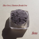 Eye shadow, matte gray powder in clear jar, Beau brand name visible
