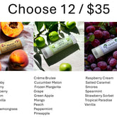 Lip balm tubes with fruit, white plastic, and text labels with flavors