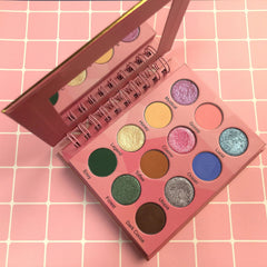 Eyeshadow palette with pink case, mirror, and 12 colorful eyeshadows