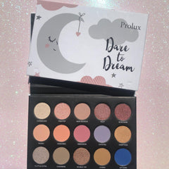 Eyeshadow palette with multiple colors, Prolux brand, and Dare to Dream text on the lid.