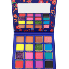 Eyeshadow palette with blue case, colorful eyeshadows, and mirror for makeup application