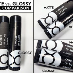 Lip balm tubes, black and white with glossy and matte finishes, Venus Complete LLC branding visible
