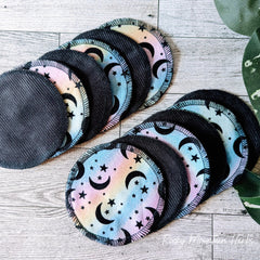 Reusable pads with black corduroy, moon and star pattern, and pastel colors
