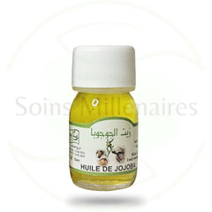 Side view of amber glass dropper bottle with golden jojoba oil, showcasing minimalist label and natural skincare aesthetic