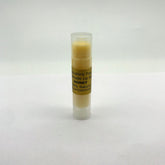 Lip balm tube with clear cap, yellow balm, and Salvatore Tripi label