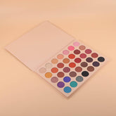 Open rectangular palette displaying 35 vibrant eyeshadow shades in matte, shimmer, and metallic finishes arranged in rows