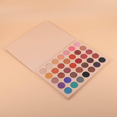 Open rectangular palette displaying 35 vibrant eyeshadow shades in matte, shimmer, and metallic finishes arranged in rows