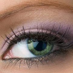 Eye makeup purple shimmer eyeshadow applied to eyelid with green eye and lashes