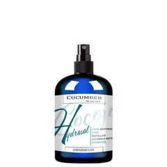 Cucumber hydrosol spray bottle with blue glass, white label, and black pump top