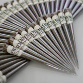 Henna tubes, silver and brown conical tubes, "HENNATUBEN" label visible
