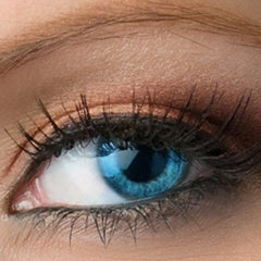 Eye shadow application with burgundy and copper shimmer, visible on eyelid with long, dark eyelashes