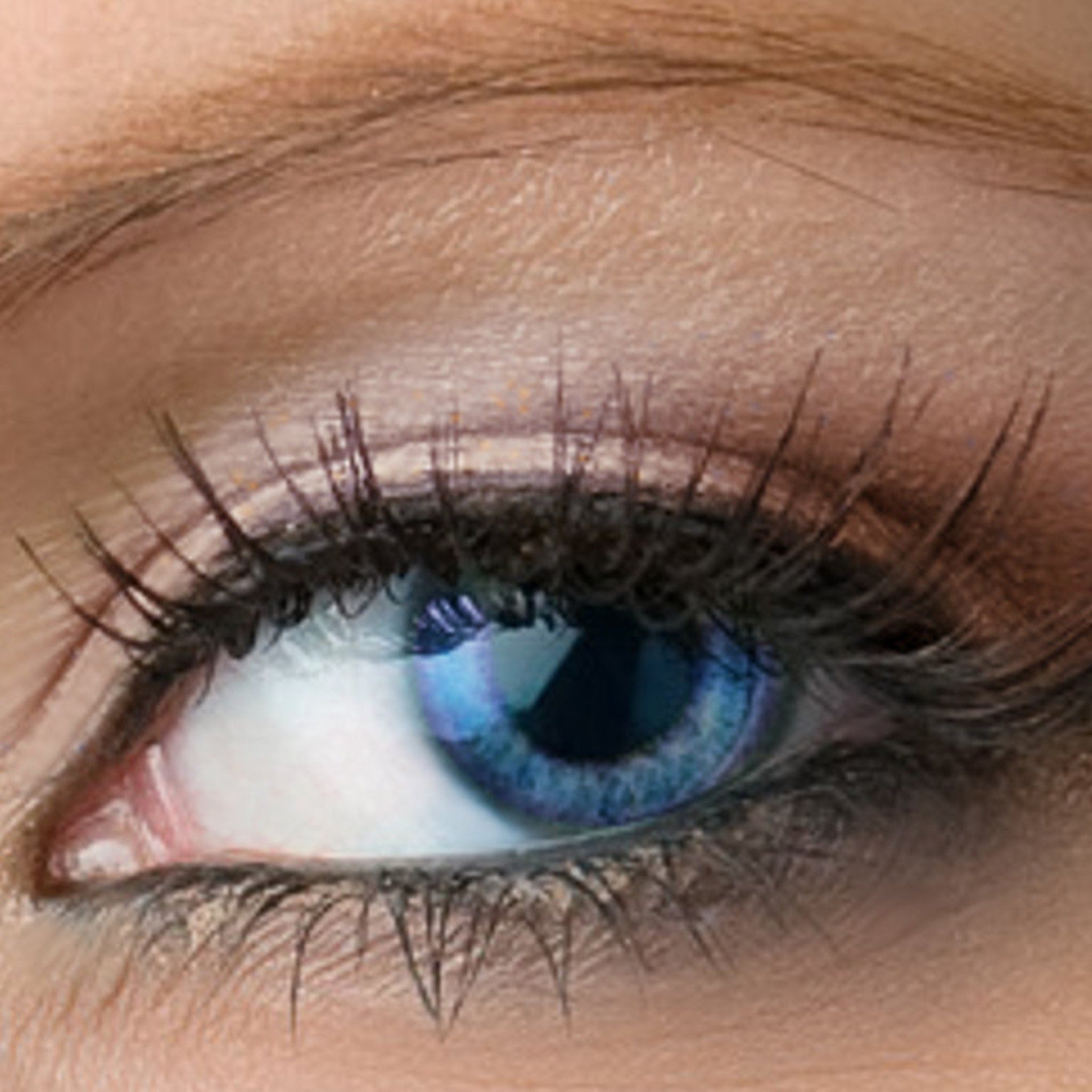 Peach tan eyeshadow compact with vibrant blue shimmer, vegan mineral makeup in sleek round case