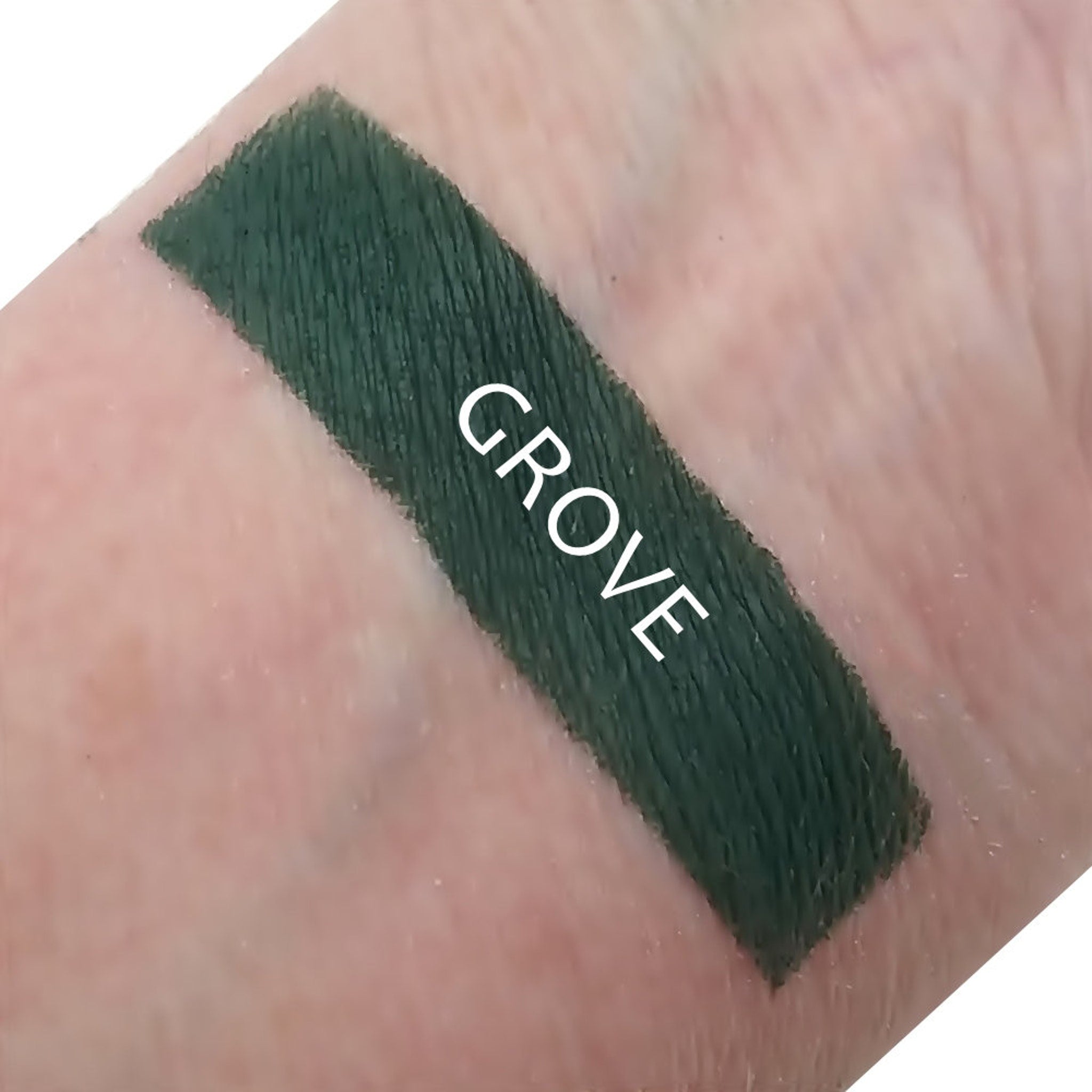 Front view of Grove matte eye shadow compact in a neutral shade with smooth, velvety texture and minimalist packaging