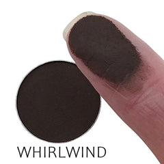 Close-up of matte whirlwind eyeshadow pan showing smooth powder texture in rich neutral tones