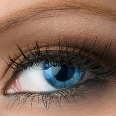 Blue eye with black eyelashes, close-up view of skin and eyebrow, natural skin tone