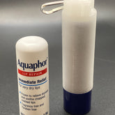 Lip balm holder, white 3D printed, blue base, with Aquaphor lip balm tube next to it