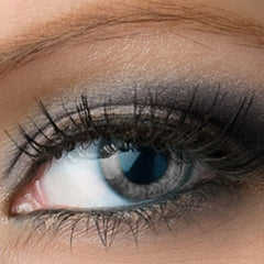 Eye makeup with black mascara, gray eyeshadow, and blue eye color close-up view