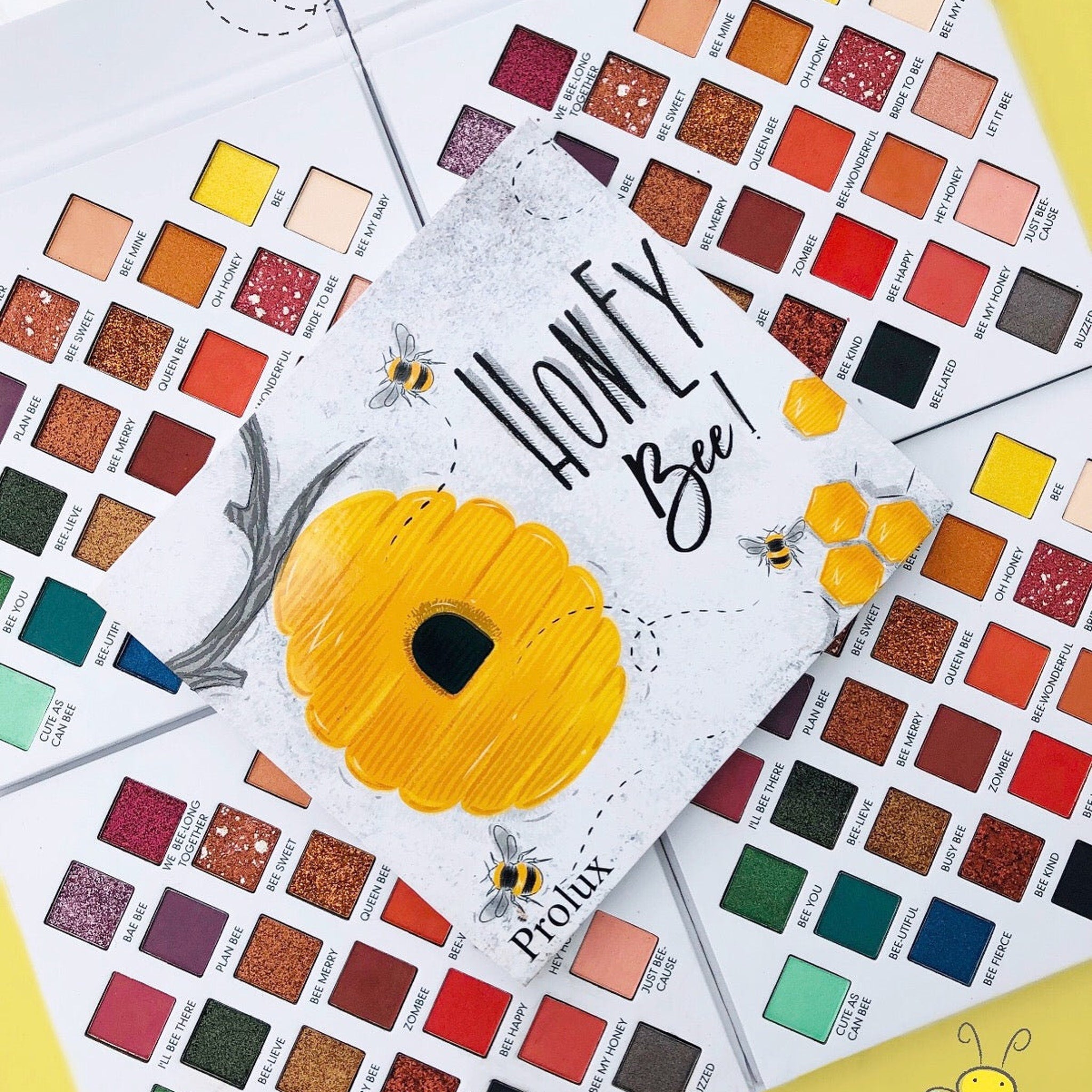 Eyeshadow palette with multiple colors, Prolux brand, Honey Bee design