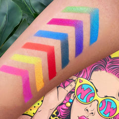 Colorful eyeshadow swatches in rainbow shades on arm, with a pop art illustration in background