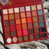 Eyeshadow palette with red, gold, and pink shades, Prolux brand, for eye makeup