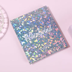 Holographic box with geometric pattern and "Whirlwind" text on pink background