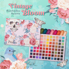 Close-up of fingers applying shimmery taupe eyeshadow with a blending brush on eyelid