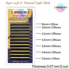 Premade eyelashes with black lashes, gold and blue backing, and LAPHITSARA branding