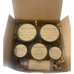 Makeup set in cardboard box with beige jars, lip balm, and Earth Mineral Cosmetics branding